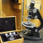 Leitz microscope with one of two boxes of attachments
